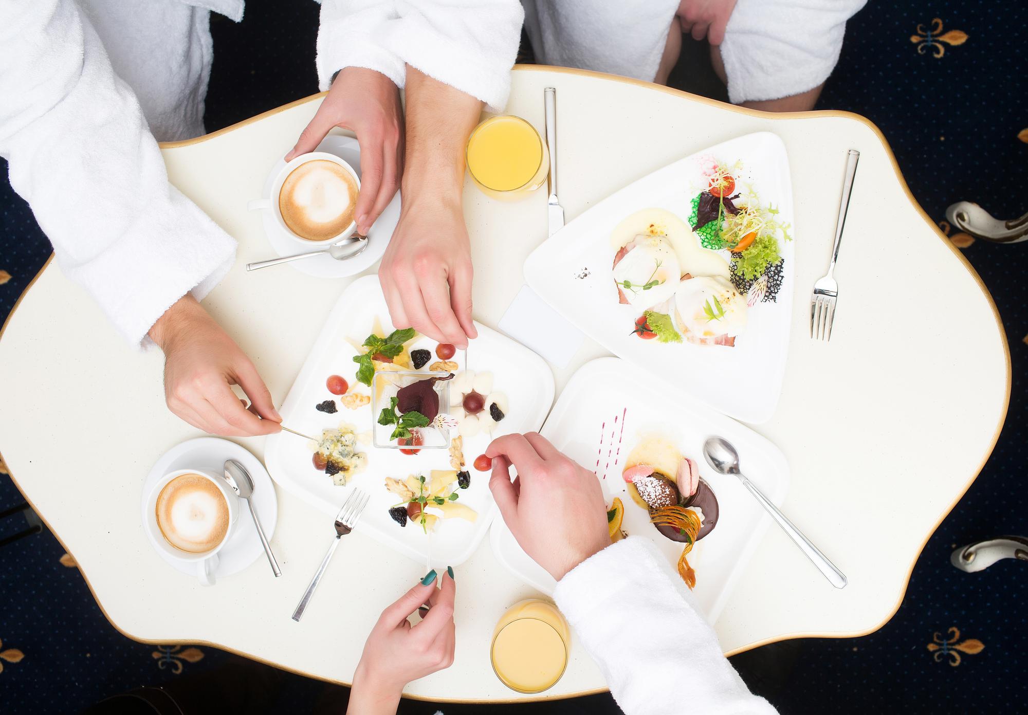 Participants tasting a dish together